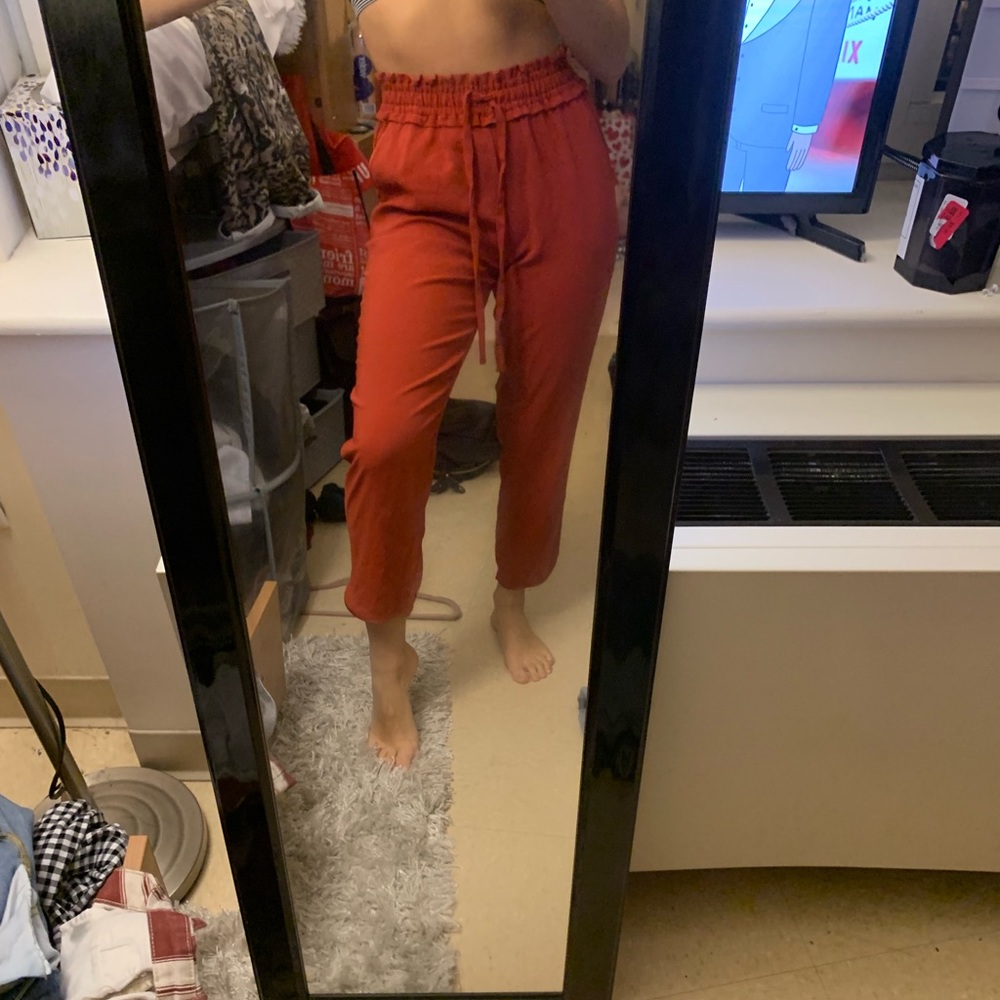 Brunt orange/red trousers